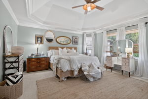 Gracious Primary Suite with fireplace, two walk-in closets, and a beautifully appointed en suite bath.
