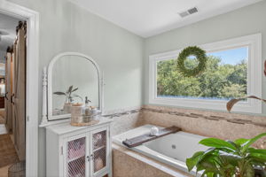 Dual vanities, dreamy soaking tub, total bliss.