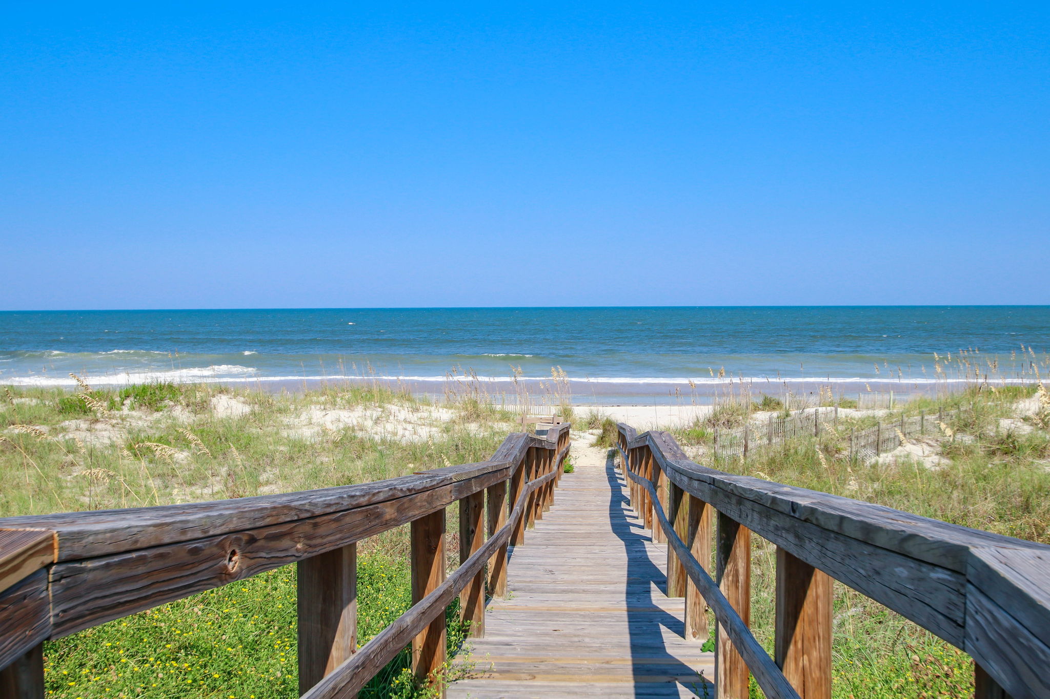 The Sea Dunes beach walkway is just steps away