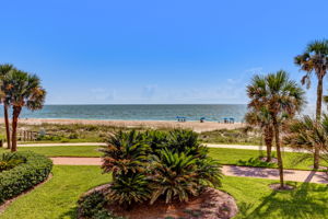 Both balcony views are a soothing mix of palms, sand, sea