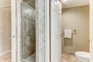 ...and floor-to-ceiling tiled shower