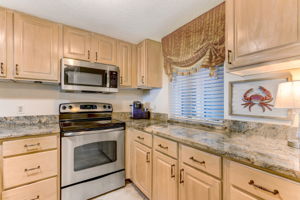 Indulge in fine cabinetry within a well-equipped kitchen...