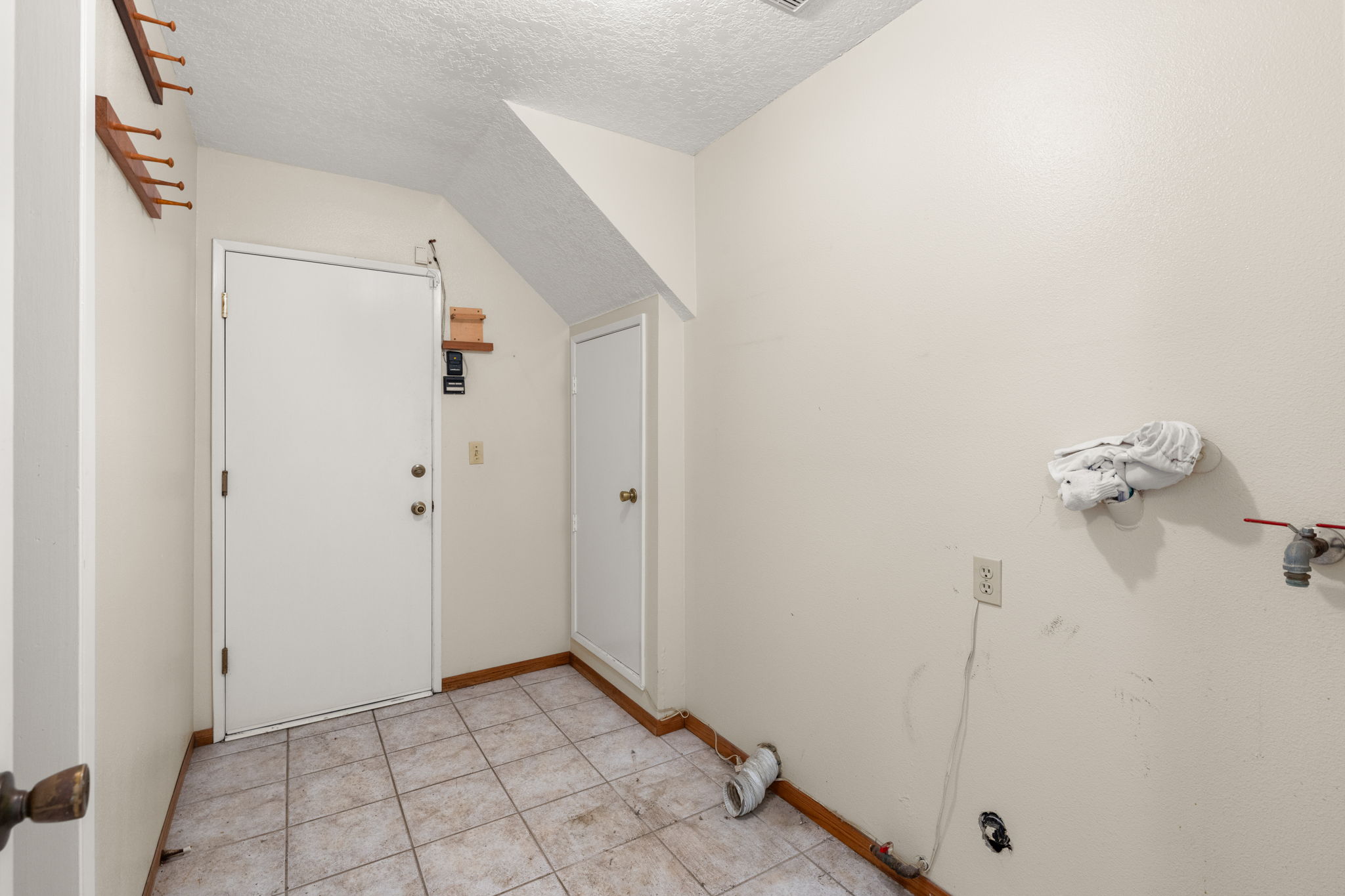 Indoor laundry room leads directly to the garage