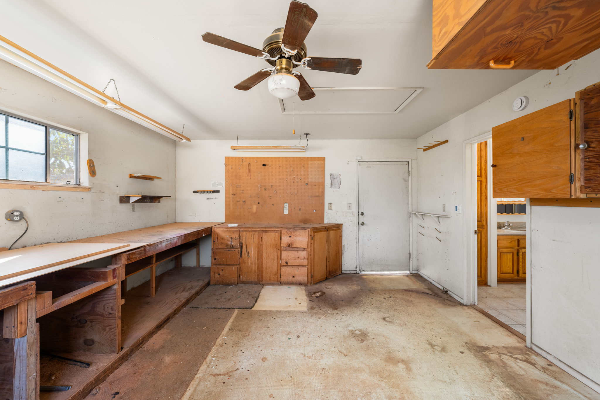 The fourth bedroom has been in use as a wood workshop; would easily be converted back into a sizable second primary bedroom