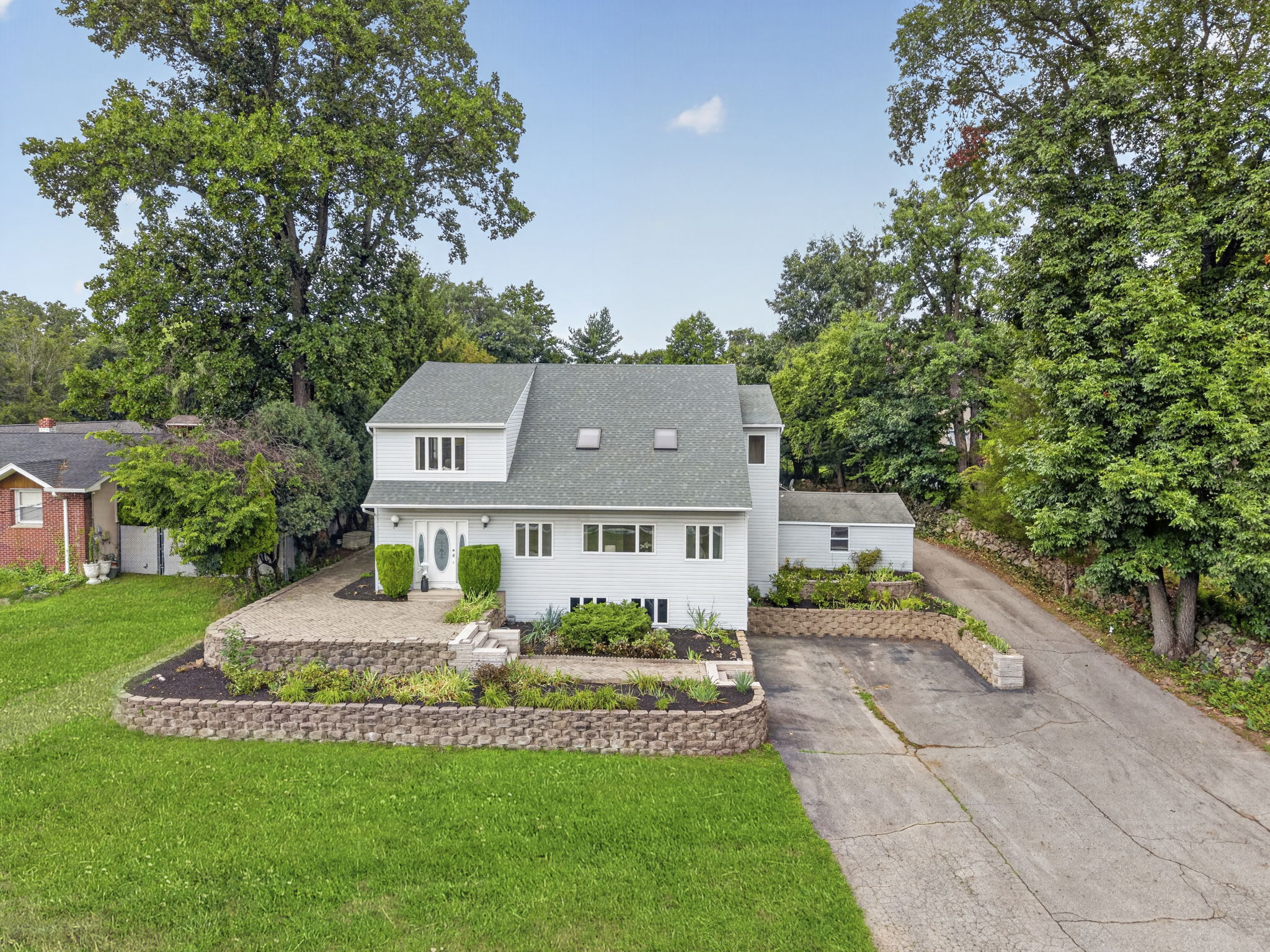 Welcome to 163 Oldham Road in Wayne, NJ, a deceptively spacious 4-bedroom, 2.5-bath home offering 3,204 square feet of living space on .9 acres. Generously sized rooms, mostly hardwood floors and a detached tandem garage accommodating up to five cars make this property a truly distinctive find.