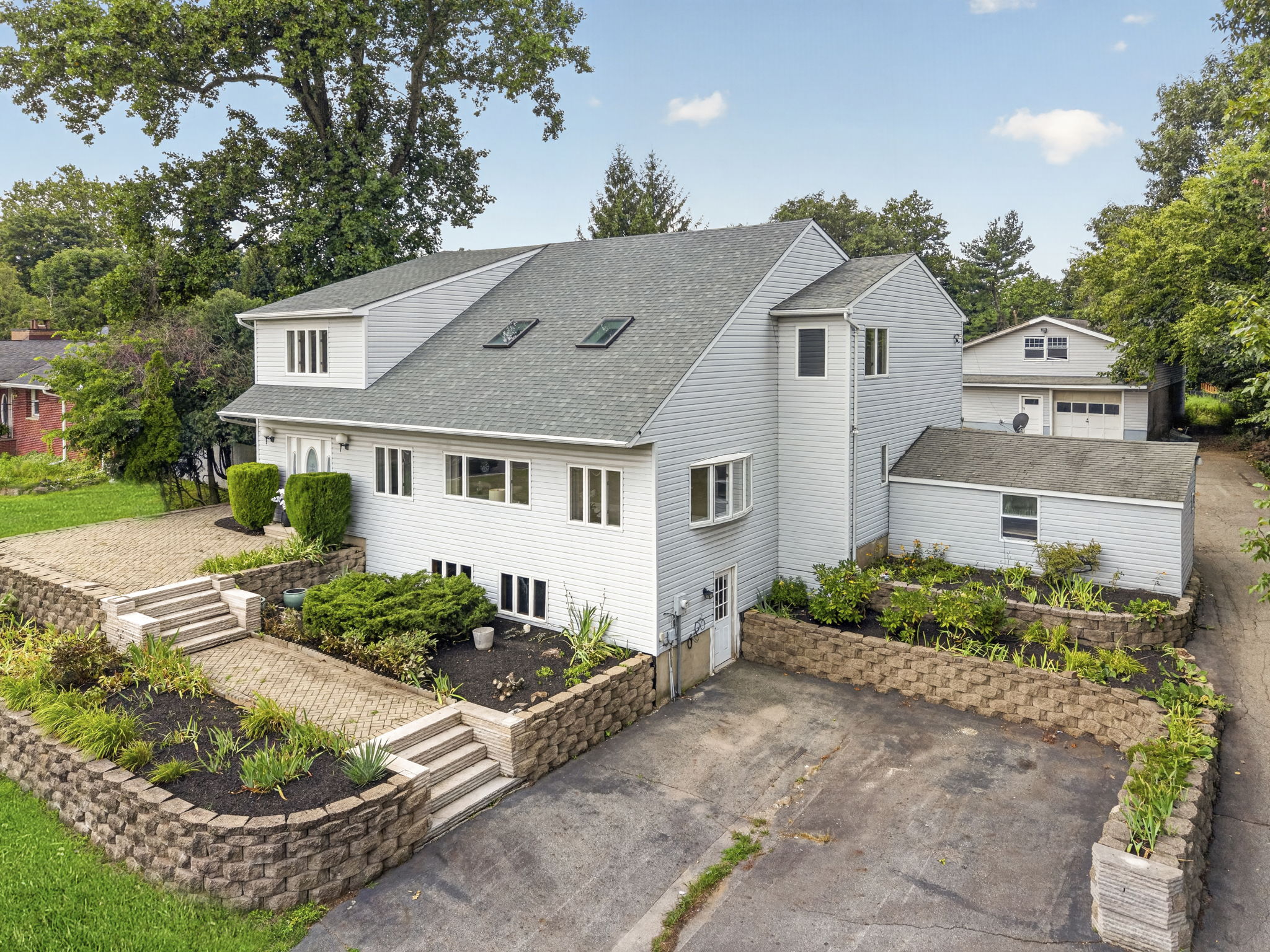 Welcome to 163 Oldham Road in Wayne, NJ, a deceptively spacious 4-bedroom, 2.5-bath home offering 3,204 square feet of living space on .9 acres. Generously sized rooms, mostly hardwood floors and a detached tandem garage accommodating up to five cars make this property a truly distinctive find.
