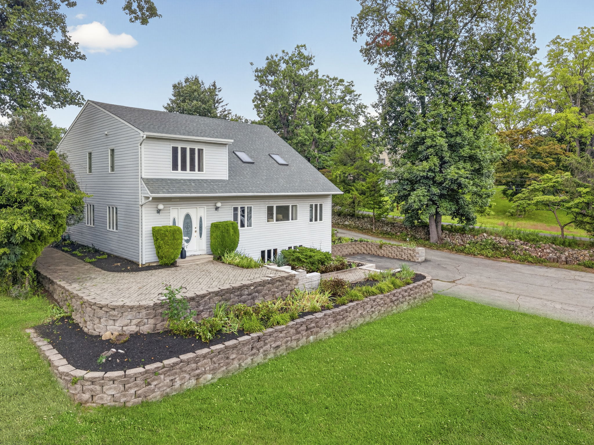 Welcome to 163 Oldham Road in Wayne, NJ, a deceptively spacious 4-bedroom, 2.5-bath home offering 3,204 square feet of living space on .9 acres. Generously sized rooms, mostly hardwood floors and a detached tandem garage accommodating up to five cars make this property a truly distinctive find.
