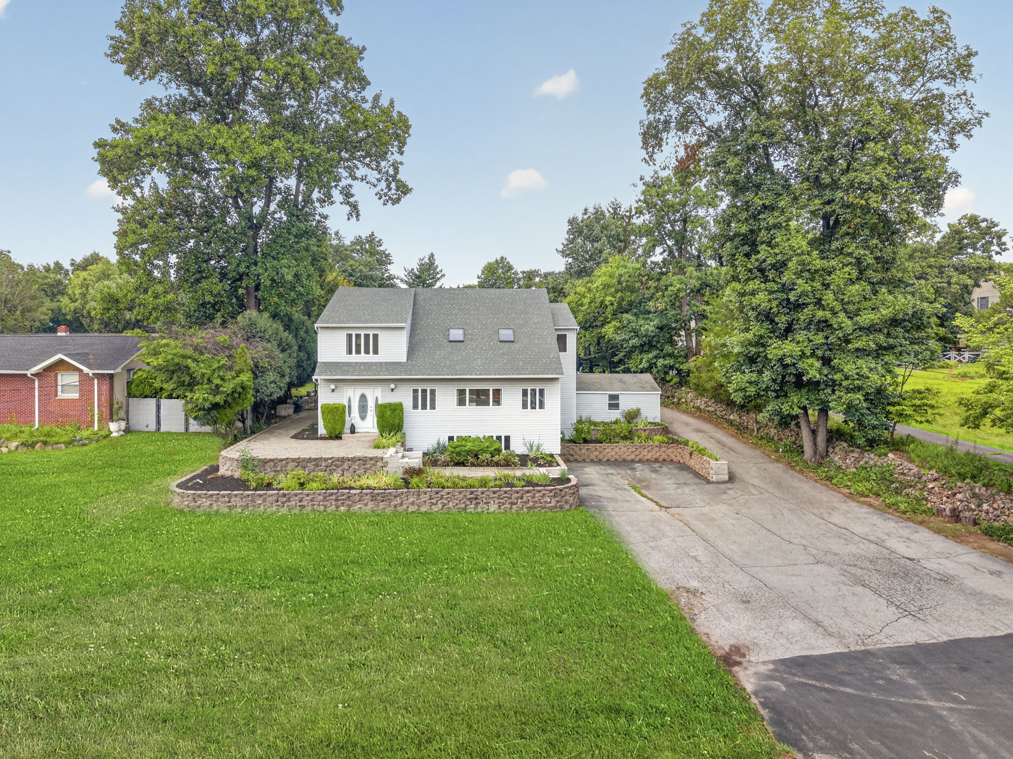 Welcome to 163 Oldham Road in Wayne, NJ, a deceptively spacious 4-bedroom, 2.5-bath home offering 3,204 square feet of living space on .9 acres. Generously sized rooms, mostly hardwood floors and a detached tandem garage accommodating up to five cars make this property a truly distinctive find.
