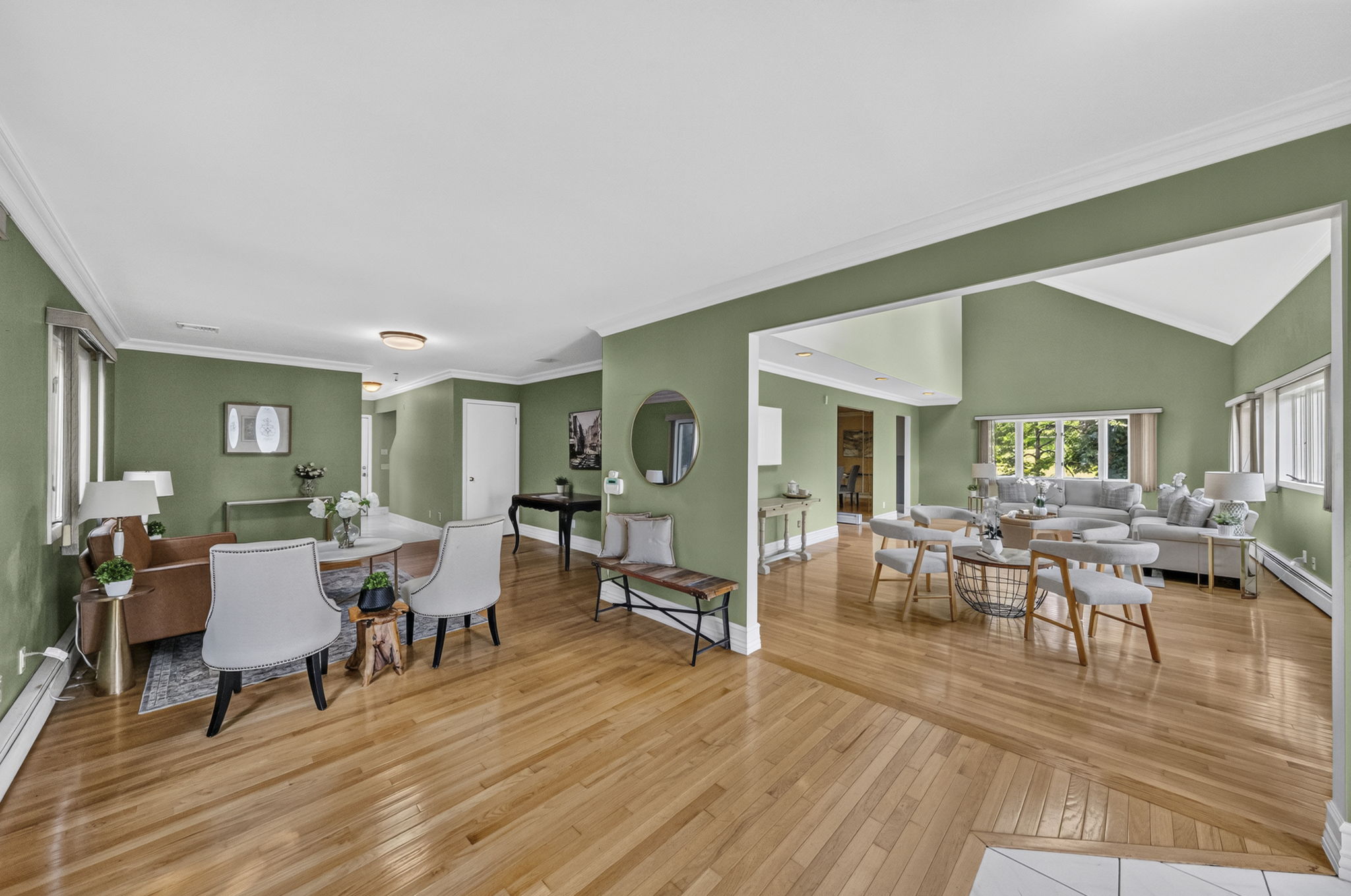 A warm and welcoming foyer leads to the spacious living room and an impressive great room filled with natural light from skylights set into the vaulted ceiling.