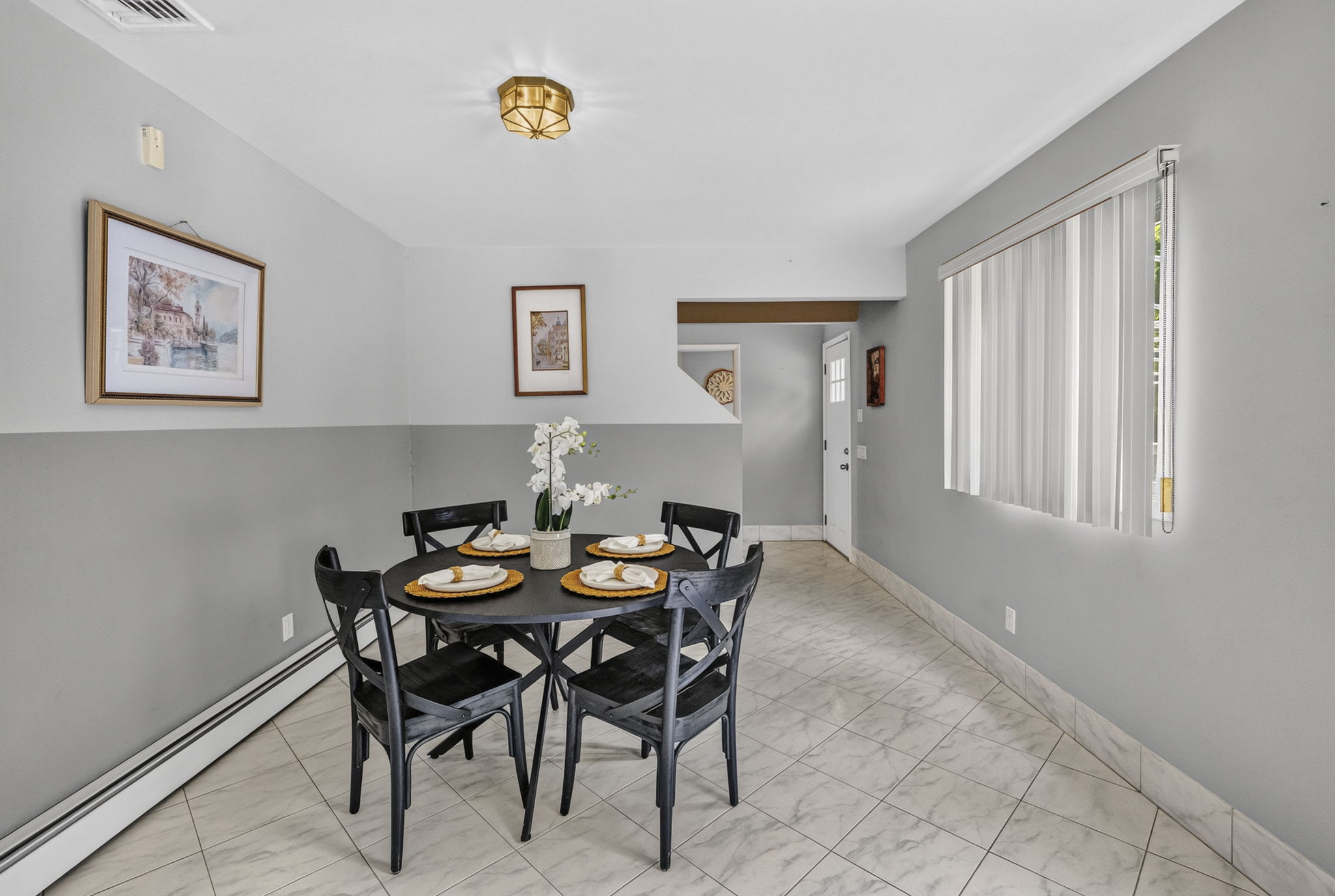 Eat in Kitchen: Designed for gathering, the eat-in kitchen features white lacquer cabinetry, a pantry, dedicated coffee bar and large center island with seating for up to six. A separate dining area provides additional seating and creates an easy flow between cooking, dining and entertaining.