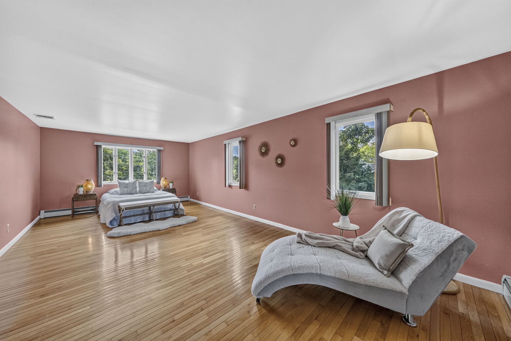 Primary Bedroom En Suite: Upstairs, the exceptionally spacious primary suite has room for a king-size bed and a comfortable sitting area. Storage is abundant with a walk-in closet and two additional closets, while the private primary bath offers generous space.