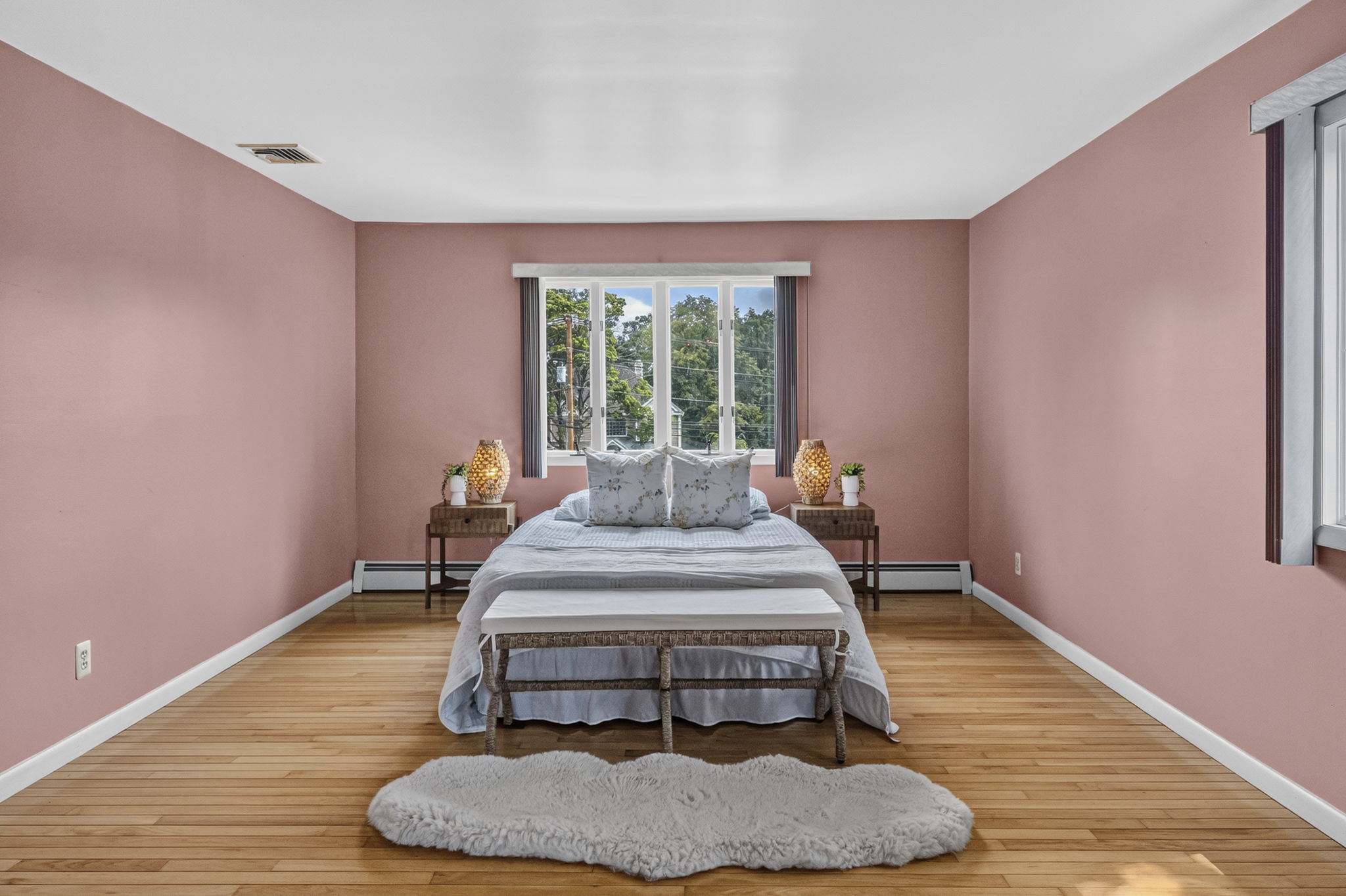 Primary Bedroom En Suite: Upstairs, the exceptionally spacious primary suite has room for a king-size bed and a comfortable sitting area. Storage is abundant with a walk-in closet and two additional closets, while the private primary bath offers generous space.