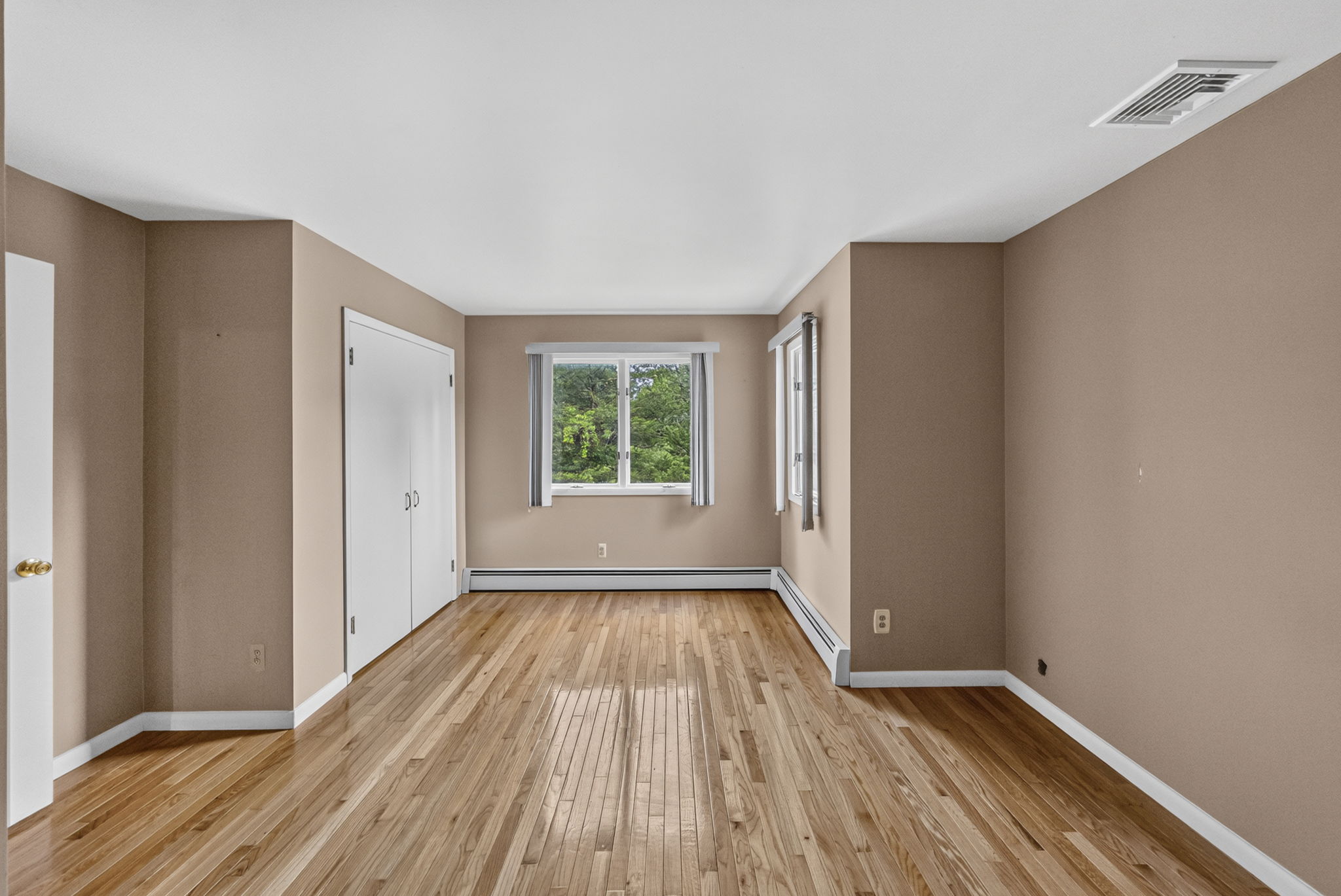 Bedroom #4: Three additional well-sized bedrooms share a main bath featuring dual sinks and a separate shower and toilet area. A freshly painted second-floor laundry room keeps daily tasks conveniently close to the bedrooms. Mostly hardwood floors run throughout the home.
