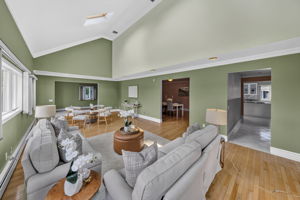 Great Room: A warm and welcoming foyer leads to the spacious living room and an impressive great room filled with natural light from skylights set into the vaulted ceiling.