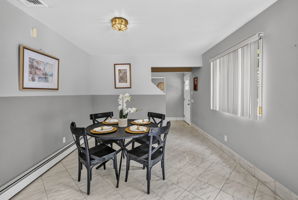 Eat in Kitchen: Designed for gathering, the eat-in kitchen features white lacquer cabinetry, a pantry, dedicated coffee bar and large center island with seating for up to six. A separate dining area provides additional seating and creates an easy flow between cooking, dining and entertaining.