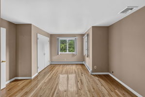 Bedroom #4: Three additional well-sized bedrooms share a main bath featuring dual sinks and a separate shower and toilet area. A freshly painted second-floor laundry room keeps daily tasks conveniently close to the bedrooms. Mostly hardwood floors run throughout the home.