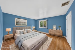 Bedroom #2-Virtually Staged: Three additional well-sized bedrooms share a main bath featuring dual sinks and a separate shower and toilet area. A freshly painted second-floor laundry room keeps daily tasks conveniently close to the bedrooms. Mostly hardwood floors run throughout the home.