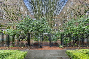 Set on a tree-lined street, the gated brick courtyard and mature landscaping offer a peaceful welcome to the timeless charm of Garden Court.