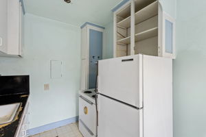 Vintage appliances and built-ins evoke a bygone era—ready for restoration or reinvention.