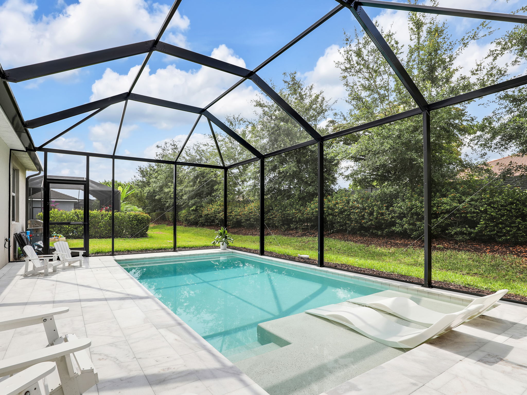 Non-Slip Marble tile surrounds Pool and in lanai