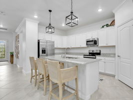 Kitchen with Granite Counters and large breakfast Bar