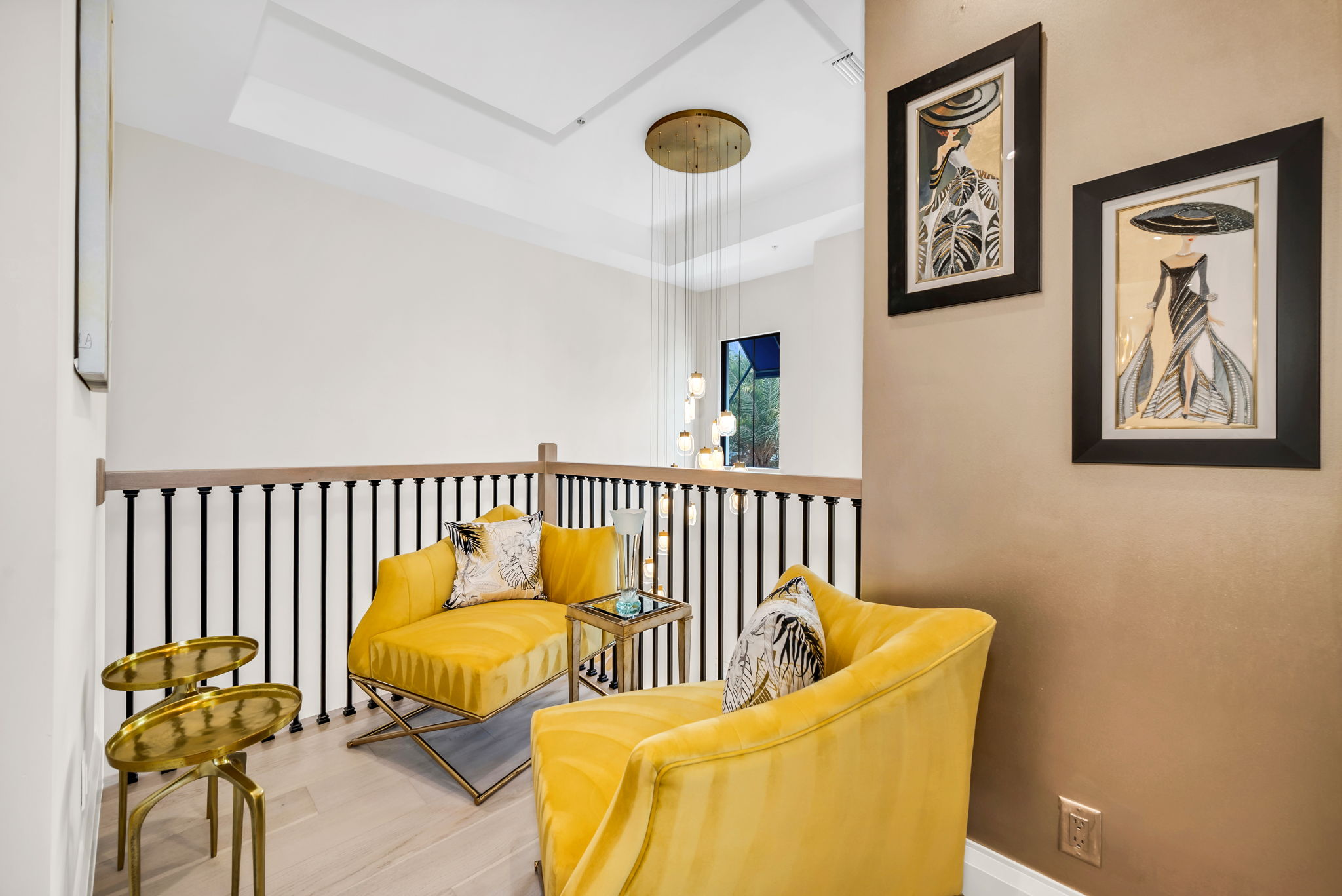 An elegant loft seating area gracefully overlooking the foyer.