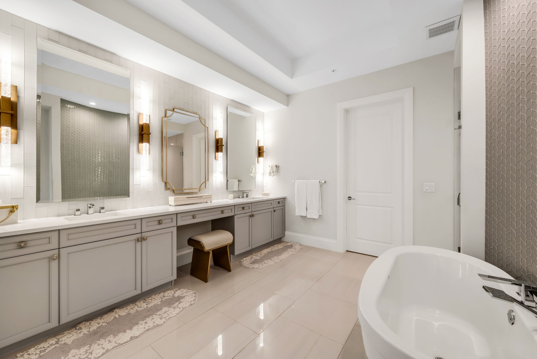 Primary Bathroom - A spa-inspired primary bath featuring an expansive walk-in shower and a luxurious soaking tub.