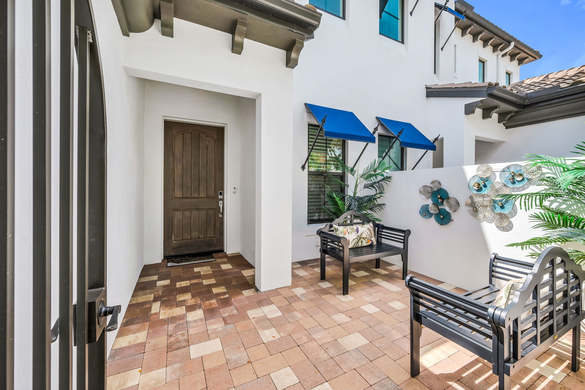 A charming front patio offering a warm and inviting welcome.