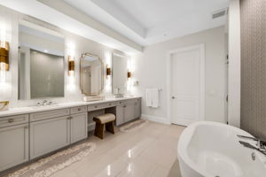 Primary Bathroom - A spa-inspired primary bath featuring an expansive walk-in shower and a luxurious soaking tub.