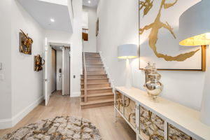 A welcoming foyer just off the two-car garage, thoughtfully equipped with a private elevator.