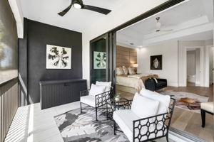 View 2 - Primary Suite with direct access to an enlarged lanai overlooking the tranquil waterway.