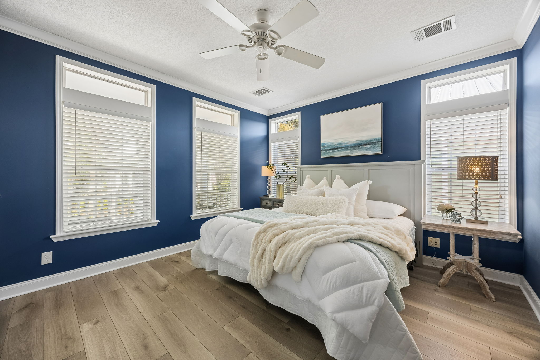 The first-floor primary suite continues the ease of one-floor living ...