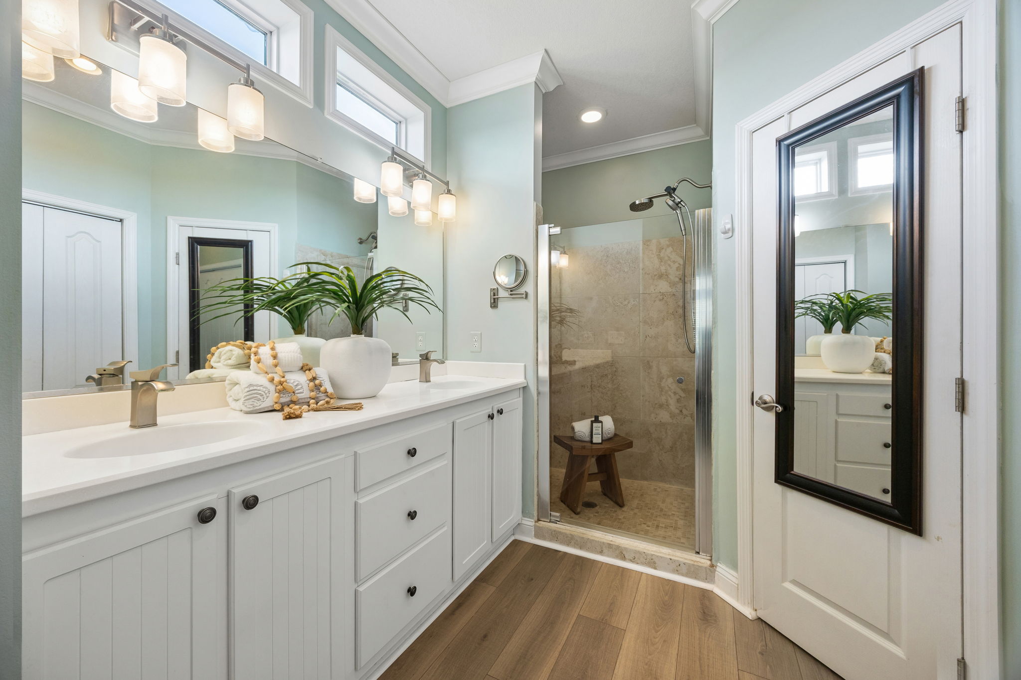 ... with dual vanities, generous storage, and a walk-in shower.