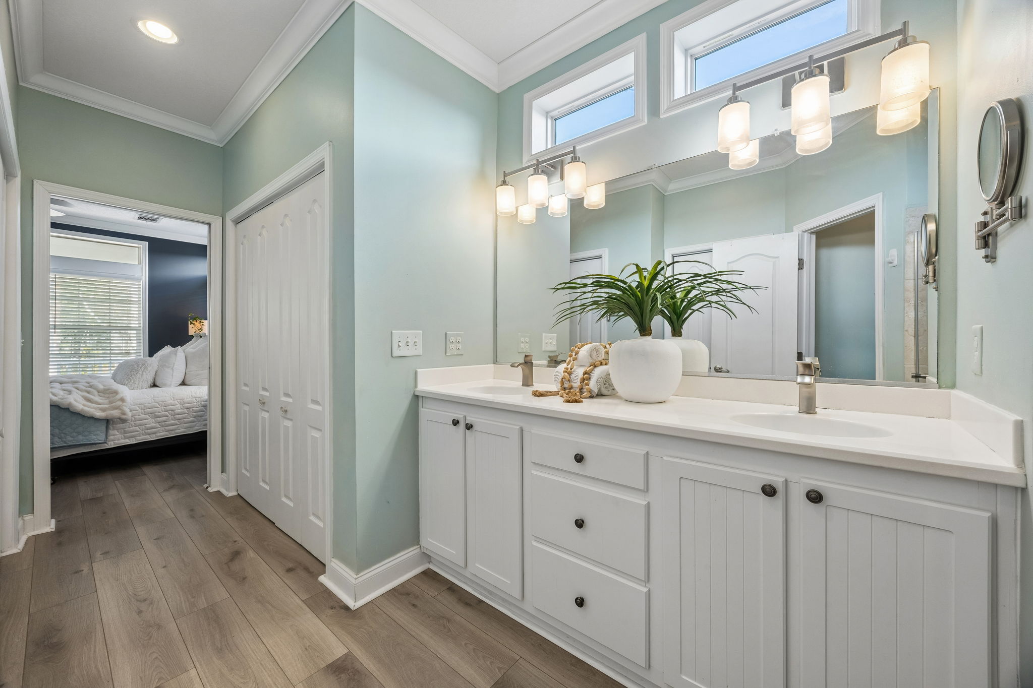 Together, the suite and bath create a main-level retreat ...