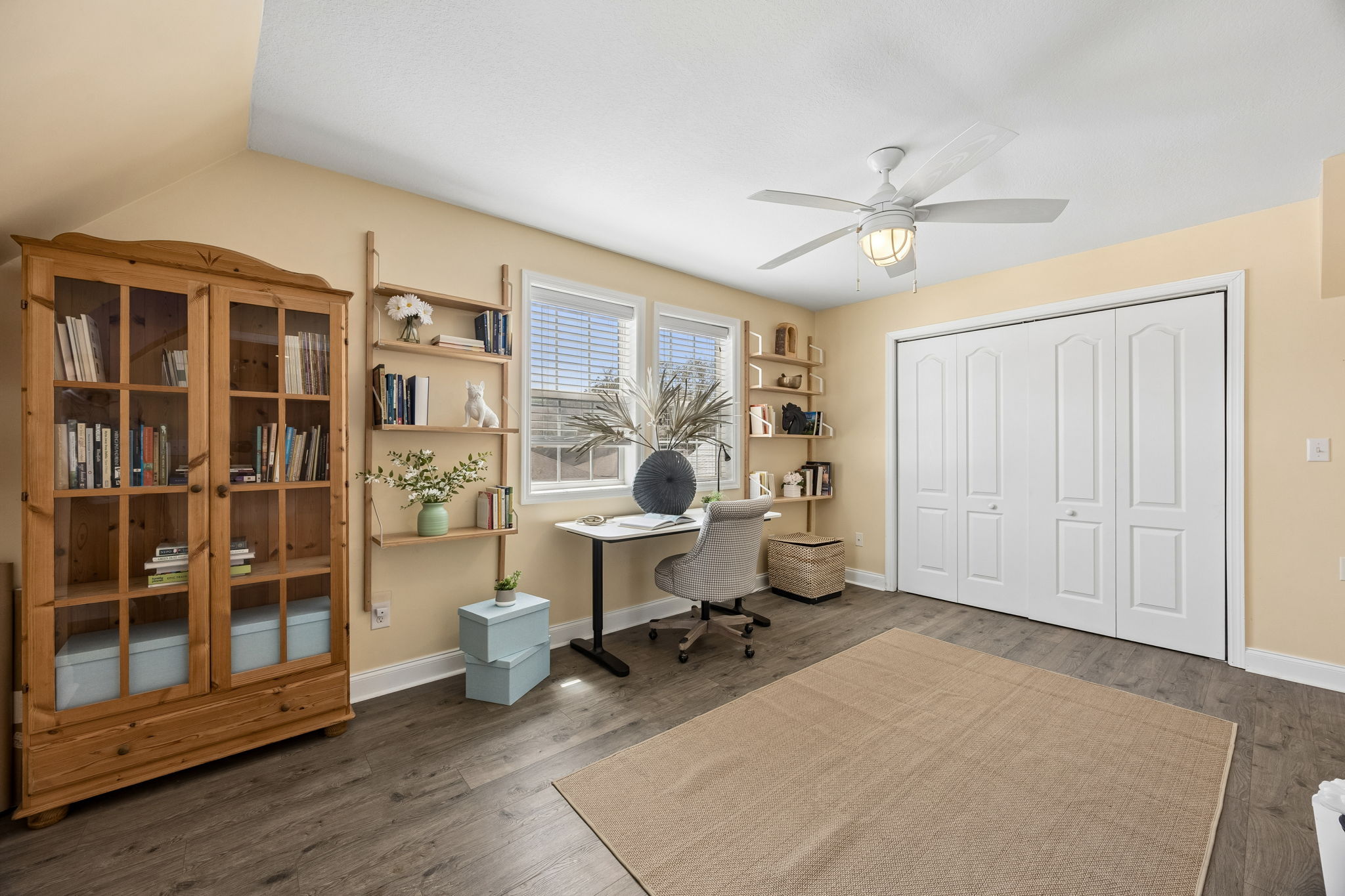 One oversized guest bedroom is currently styled as an office ...