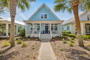 The generous front porch extends the living experience outdoors and sets the tone for what’s inside.