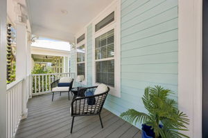 There is room here for morning coffee, afternoon reading, or an evening visit with neighbors passing by.