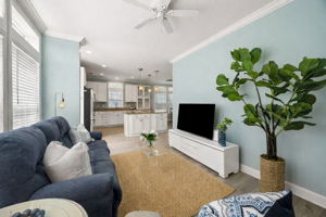 Wrapped in windows and open to the kitchen ...