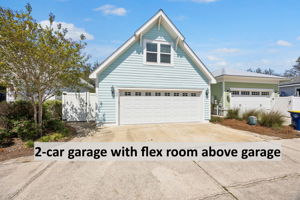 Just beyond, the detached two-car garage adds practical convenience ...