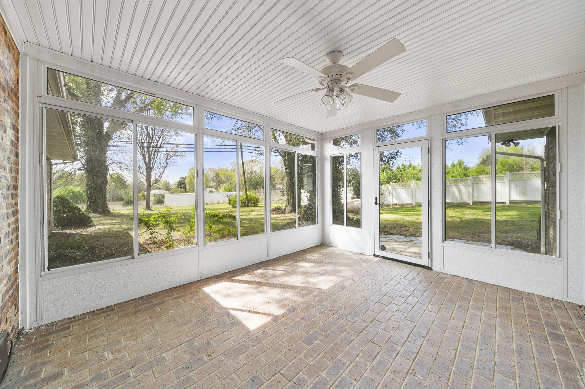 Sunroom with brick pavers