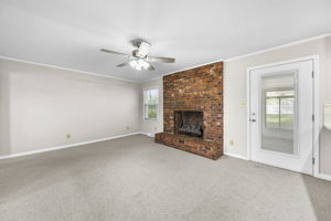 Den with gas log fireplace