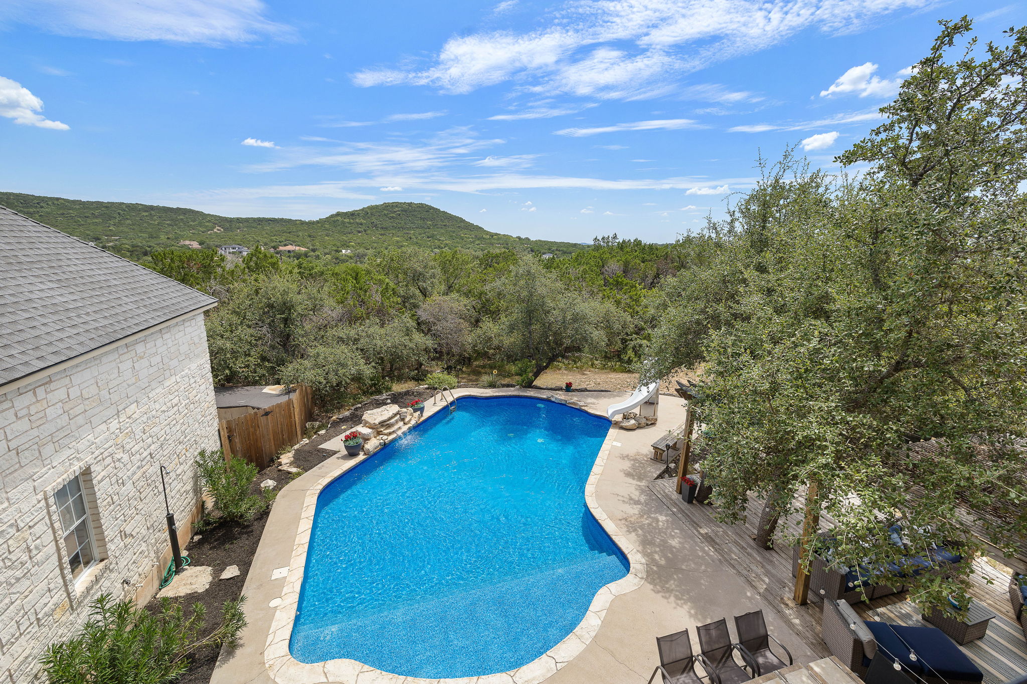 Sweeping view of hill country and pool