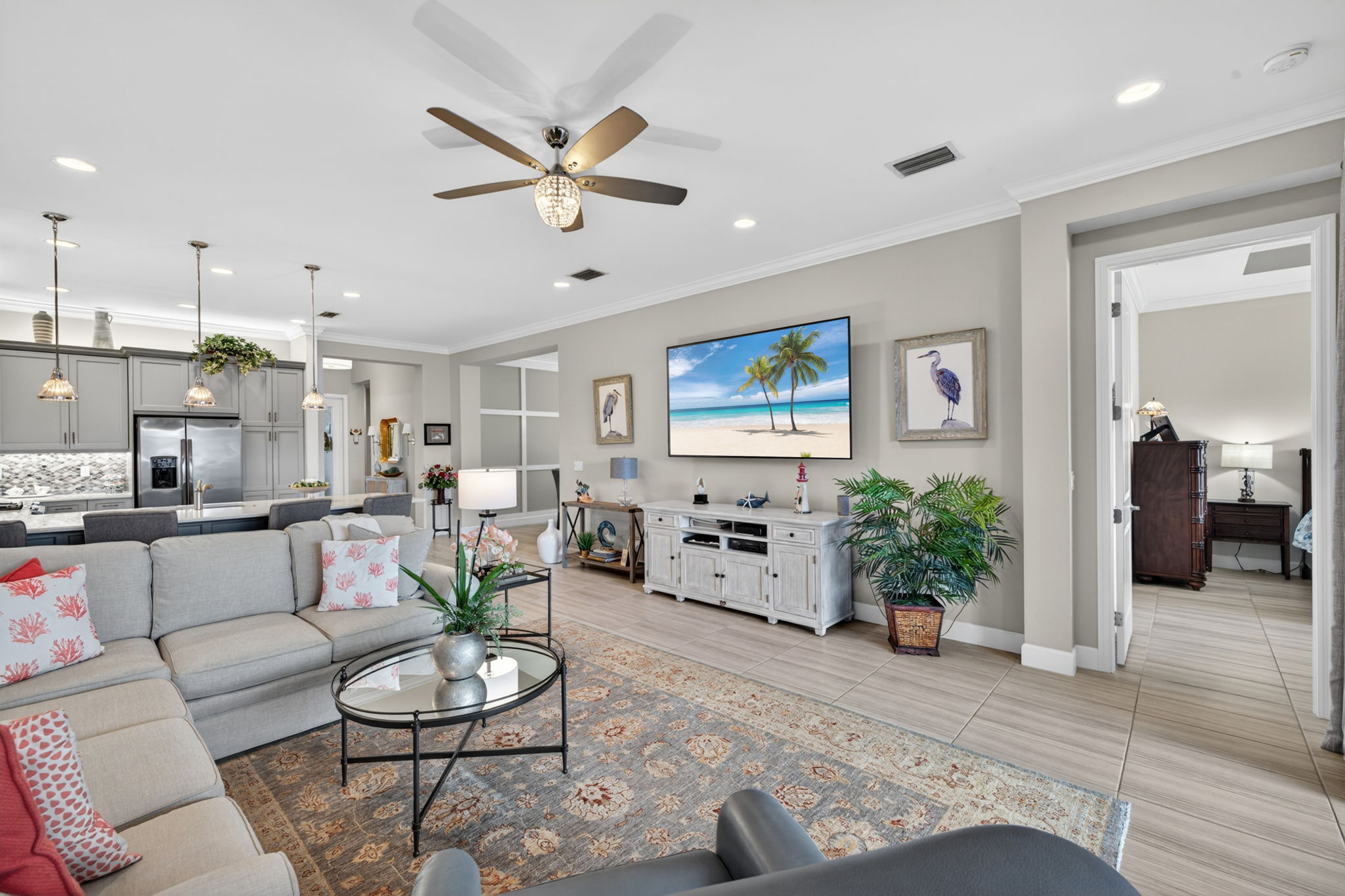 3rd view of great room w/ sneak peak of custom wall in formal dining room!