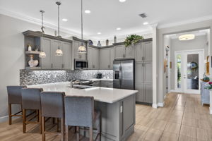 Bar seats 4! Custom woodwork on peninsula. Undercabinet lighting! Beautiful backsplash! Pantry!