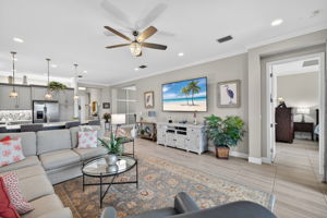 3rd view of great room w/ sneak peak of custom wall in formal dining room!