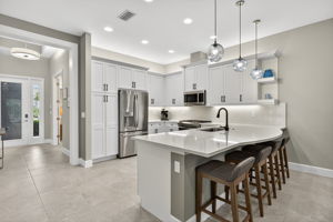 Generous pantry, upgraded French door fridge, modern hardware and soft close drawers all present here!