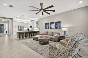 This floor plan is popular because of the openness from foyer to rear of home, w/ separate dining room and wide open living space. Beautiful, glass pendant lighting!