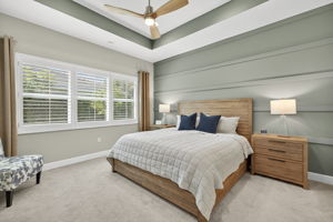 Lovely accent wall and plantation shutters make this primary bedroom special. Large enough to hold a king sized bed, 2 nightstands, a chair and a triple dresser!