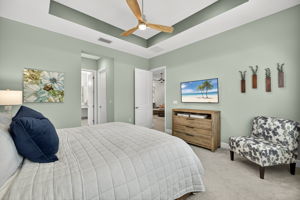 Tray ceiling and upgraded ceiling fan present here!