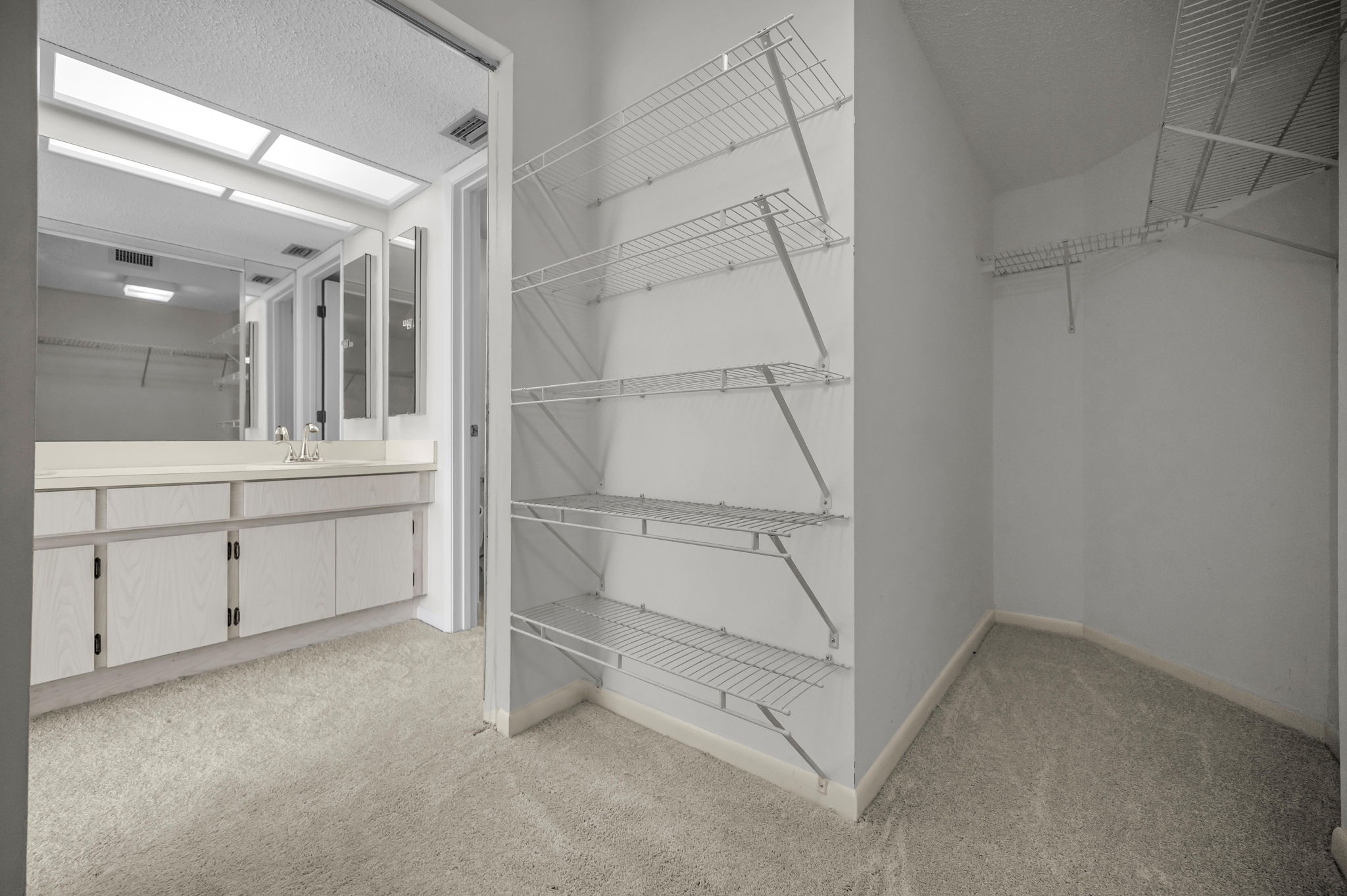 Primary Bedroom Walk-in Closet1b